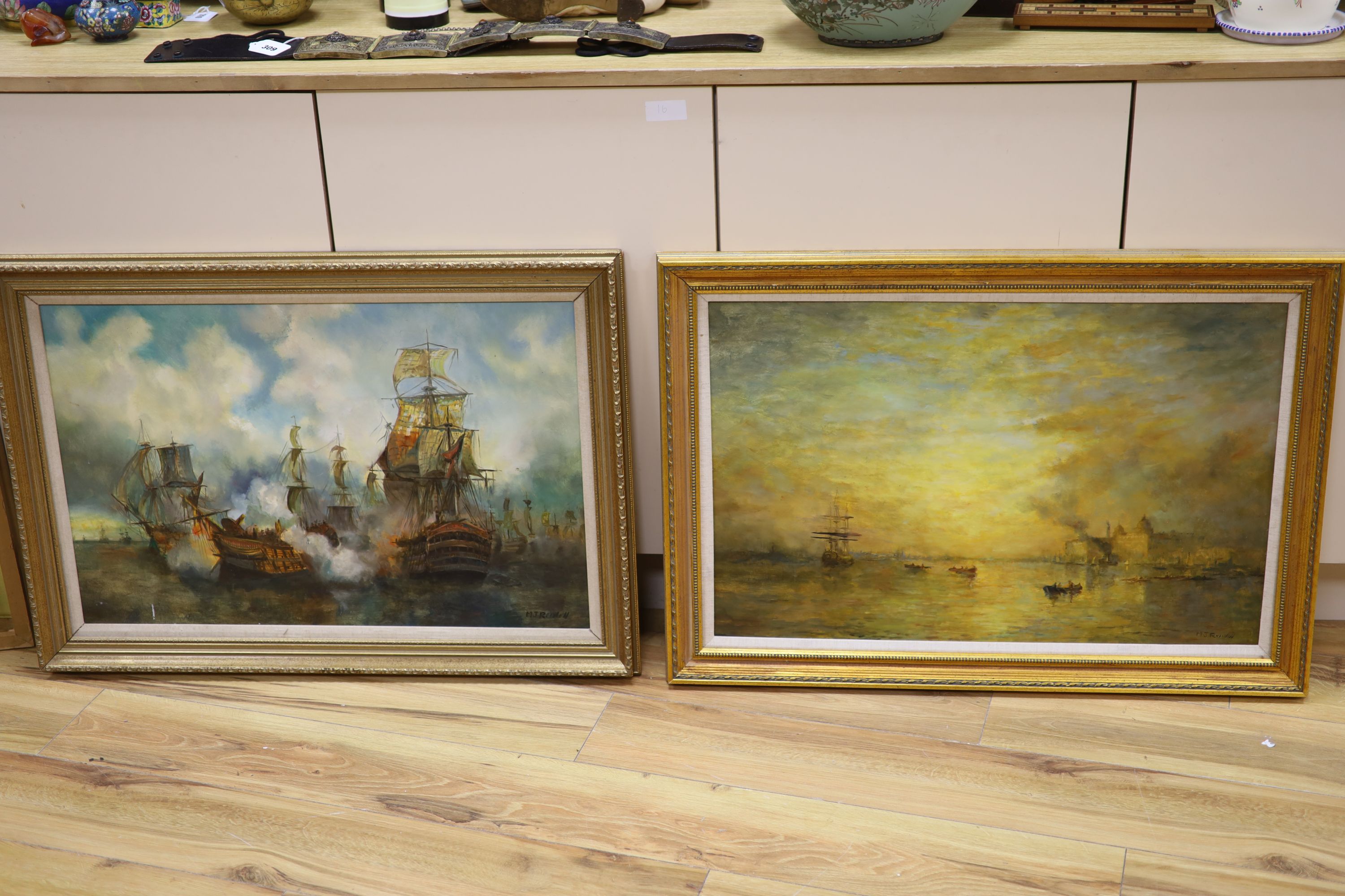 M.J. Rendell, two oils on board, Sunset over Greenwich and Naval action, signed, both 46 x 72cm, frames differ